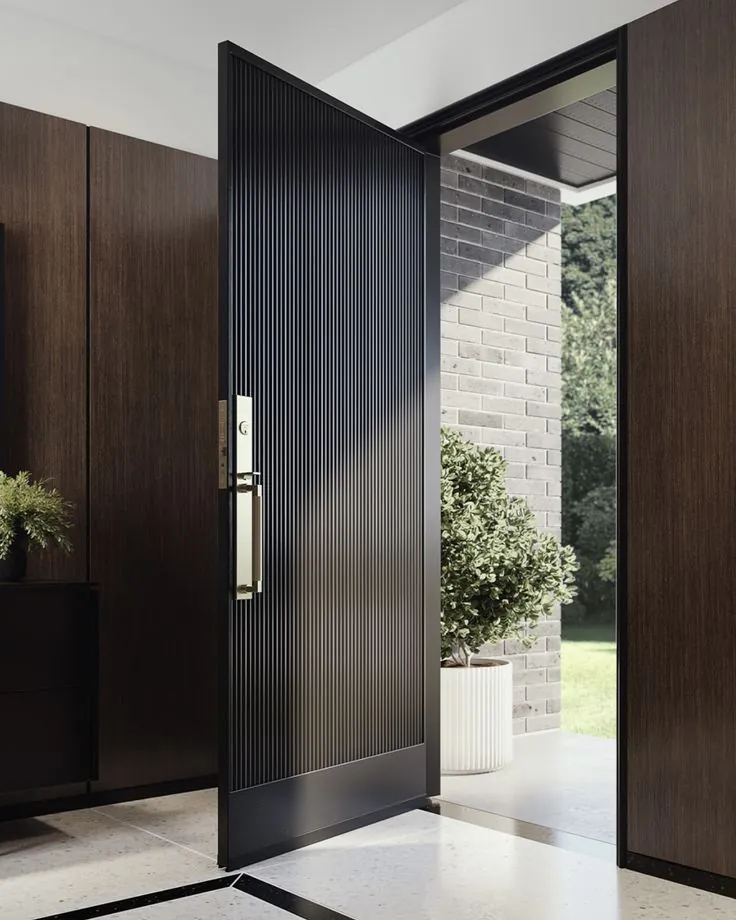 Black fluted and reeded pivot front door