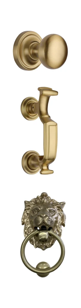 Security-door hardware in satin brass: a centre knob, a doctor door knocker and a lion-head knocker