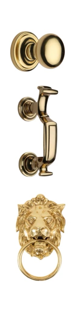 Security-door hardware in polished brass: a centre knob, a doctor door knocker and a lion-head knocker